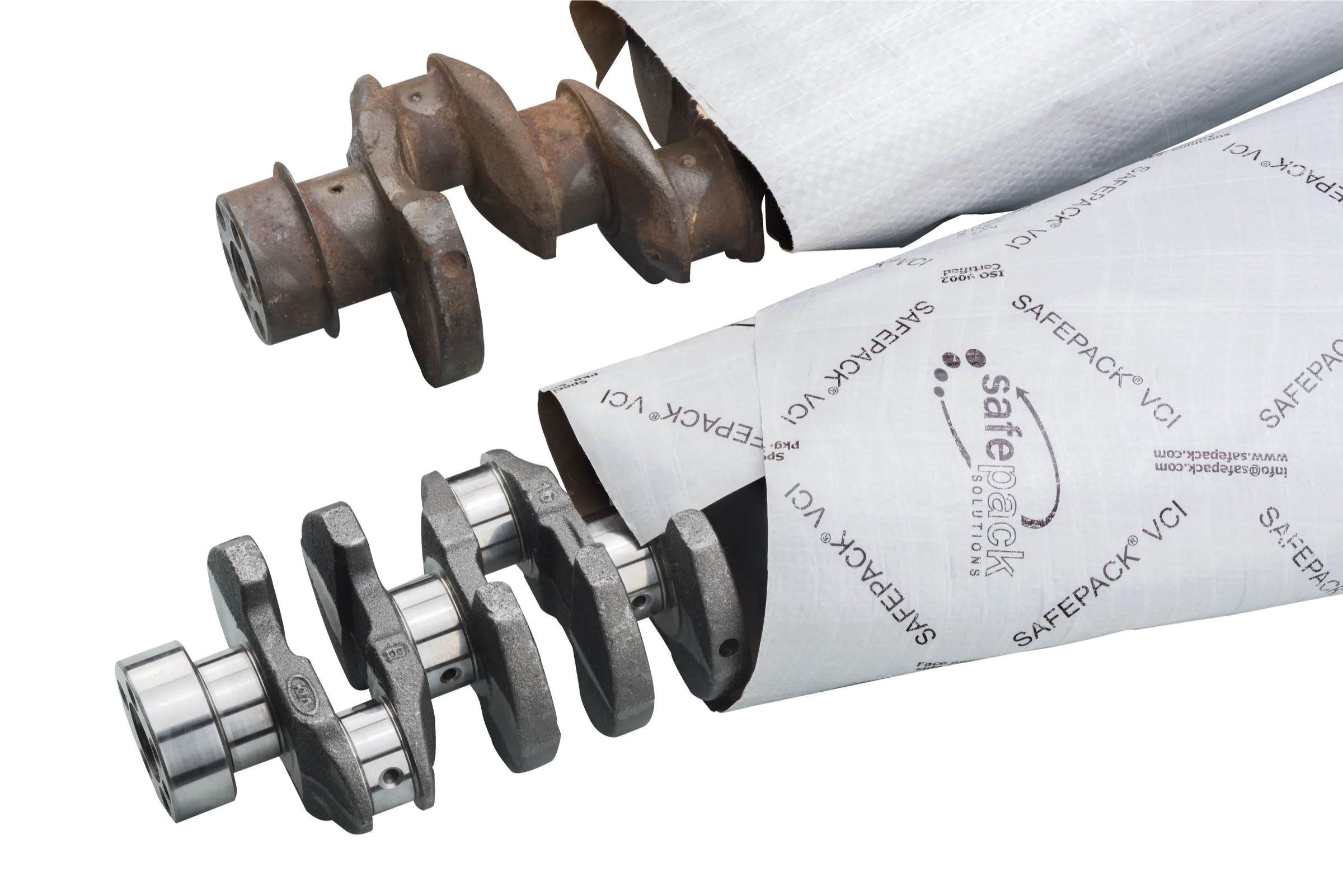 A corroded crankshaft beside an identical one sealed in VCI multiwrap