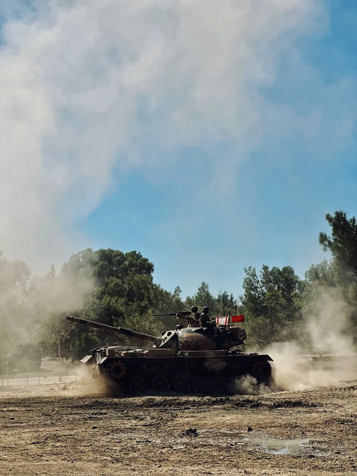 Military vehicles in desert terrain